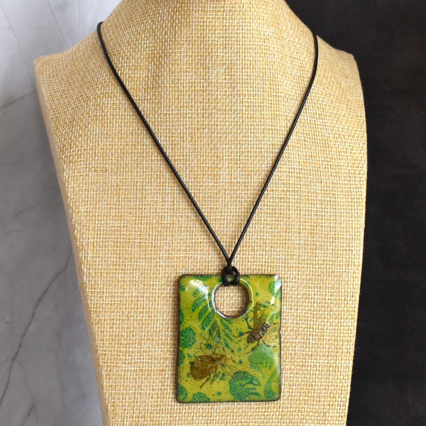 Enamelled copper pendant - green leaf design