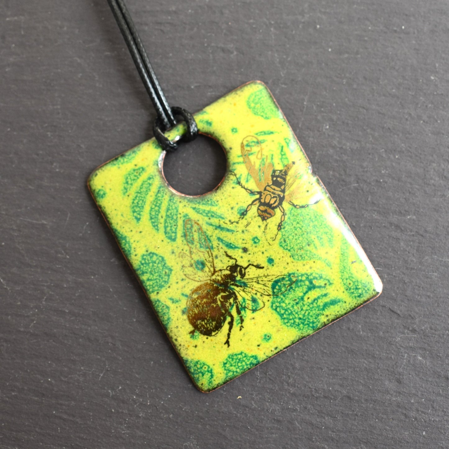 Enamelled copper pendant - green leaf design